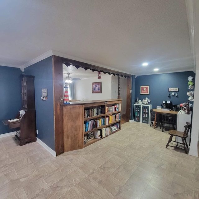 office area featuring crown molding and ceiling fan