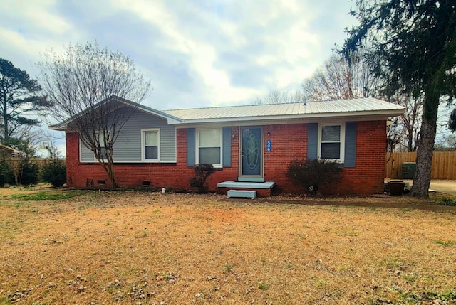 ranch-style house featuring a front lawn