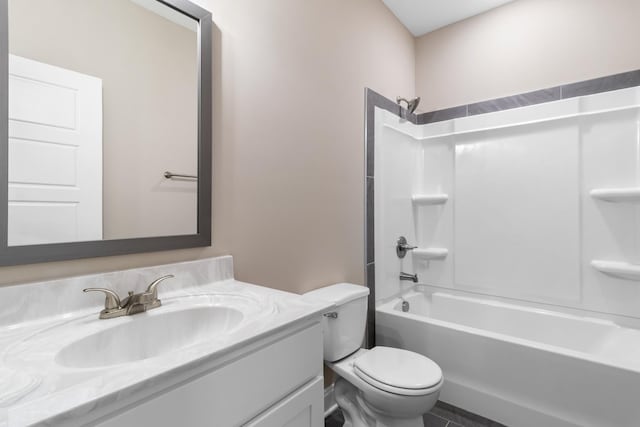 full bathroom featuring vanity, bathtub / shower combination, and toilet