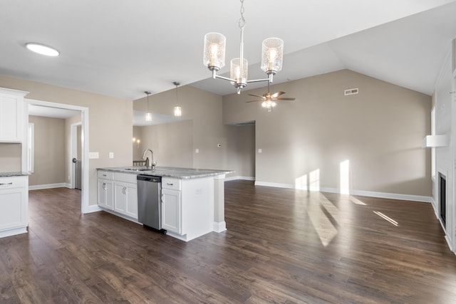 kitchen with ceiling fan with notable chandelier, pendant lighting, sink, white cabinets, and stainless steel dishwasher