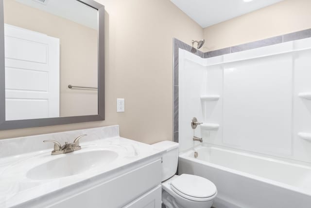 full bathroom featuring bathing tub / shower combination, vanity, and toilet