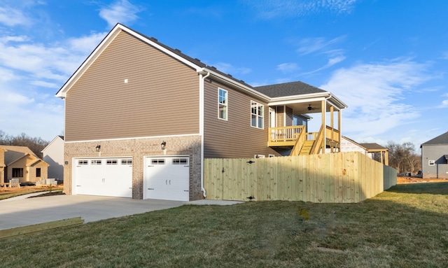 view of side of home with a garage and a yard