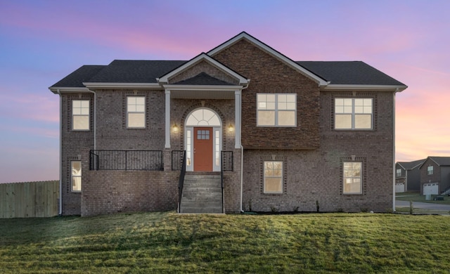 view of front of home with a lawn