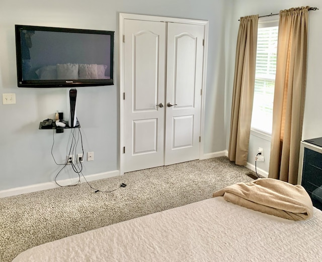 bedroom featuring a closet and carpet