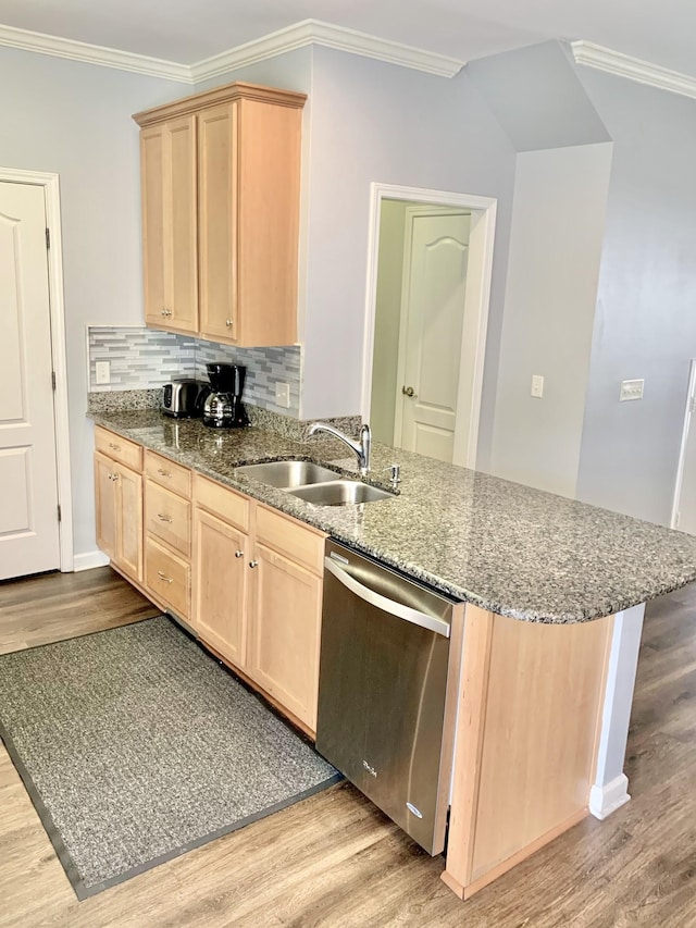 kitchen with light brown cabinetry, sink, light hardwood / wood-style flooring, and dishwasher