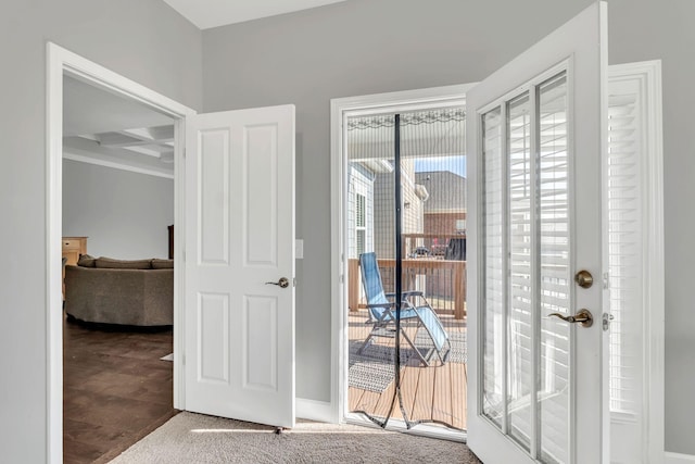 interior space with coffered ceiling, carpet floors, and beam ceiling