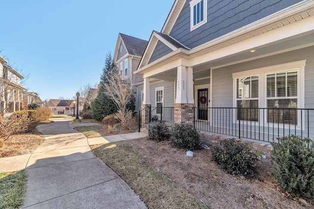 property entrance with covered porch