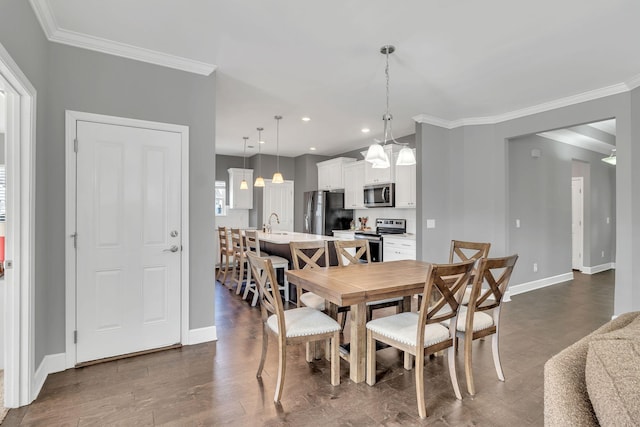 dining room featuring crown molding, dark hardwood / wood-style floors, and a wealth of natural light