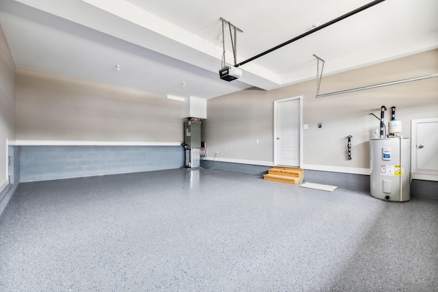 garage featuring water heater, a garage door opener, and electric water heater