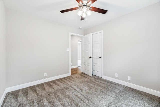 unfurnished bedroom featuring carpet floors and ceiling fan