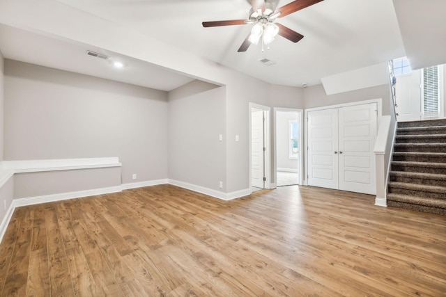 interior space with ceiling fan and light hardwood / wood-style floors