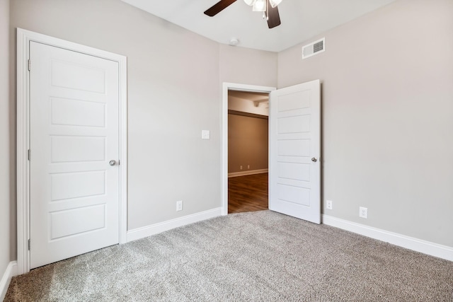 unfurnished bedroom with carpet floors and ceiling fan