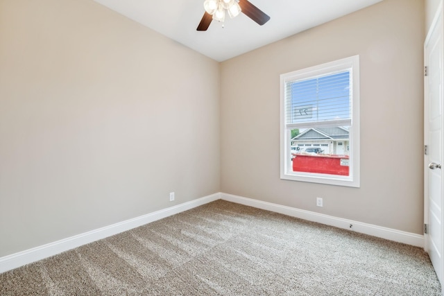 empty room featuring carpet and ceiling fan