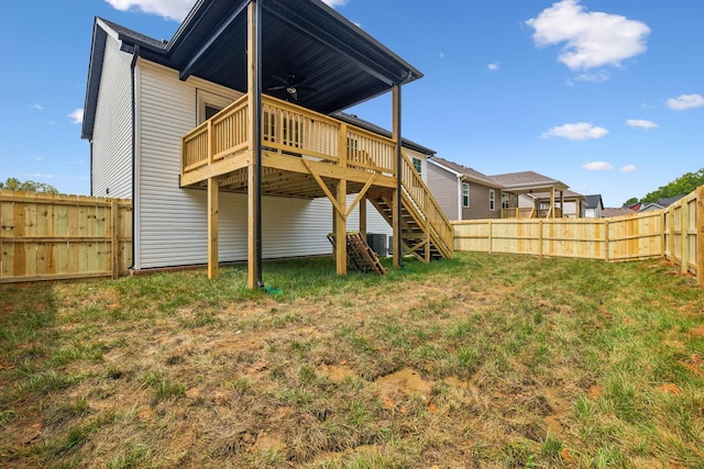 back of house featuring cooling unit, a yard, ceiling fan, and a deck