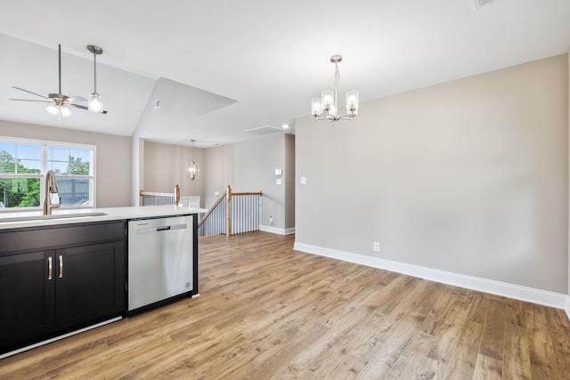 kitchen with sink, decorative light fixtures, light hardwood / wood-style flooring, dishwasher, and ceiling fan with notable chandelier