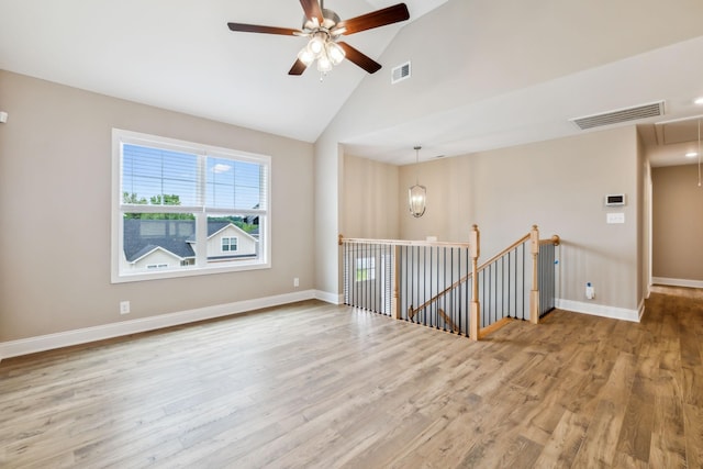 unfurnished room featuring ceiling fan, high vaulted ceiling, and light hardwood / wood-style floors