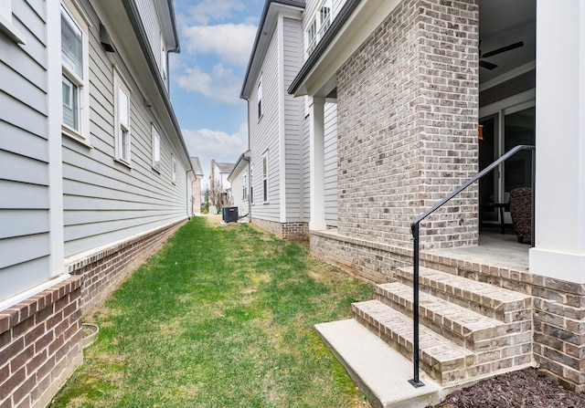 view of yard with central AC