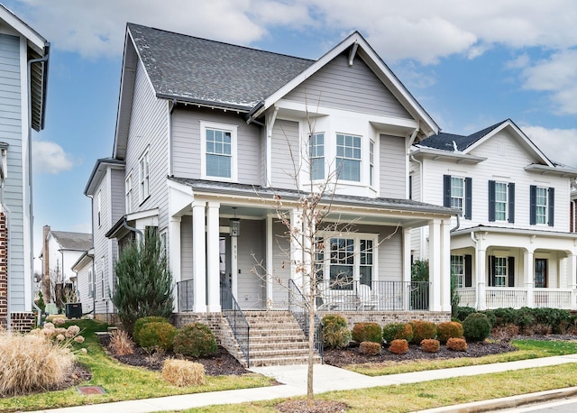 view of front of house featuring central AC unit and covered porch