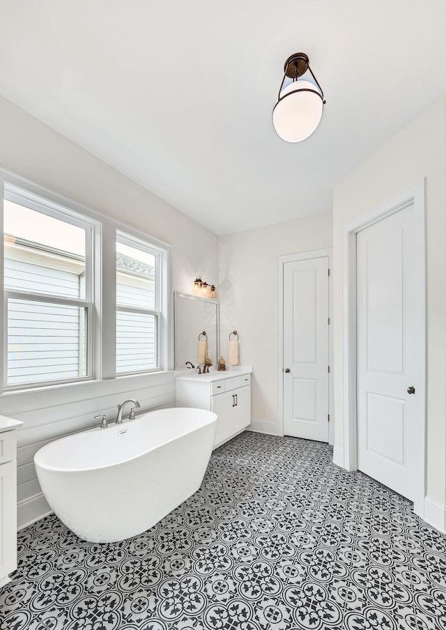 bathroom featuring a bathing tub and vanity