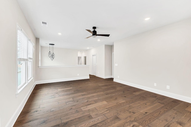 unfurnished room featuring dark hardwood / wood-style floors and ceiling fan