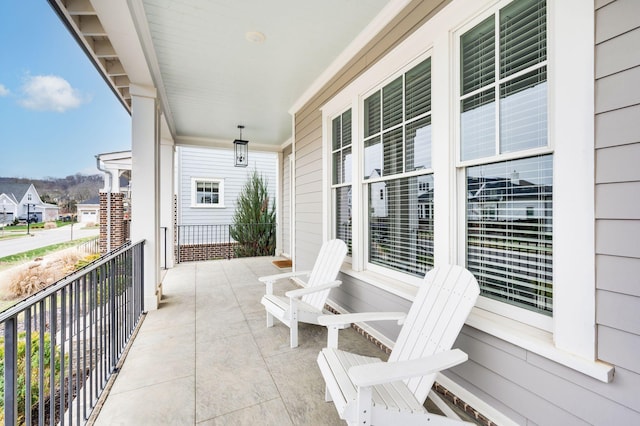 balcony featuring a porch