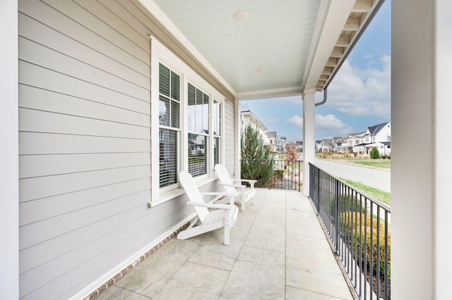 balcony featuring covered porch