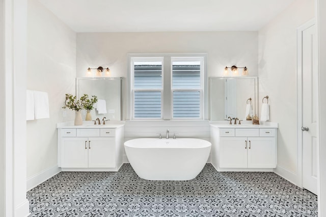 bathroom featuring a tub to relax in and vanity