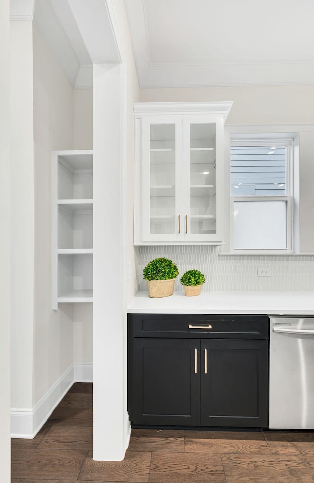 bar with white cabinets, dark wood-type flooring, ornamental molding, and dishwasher