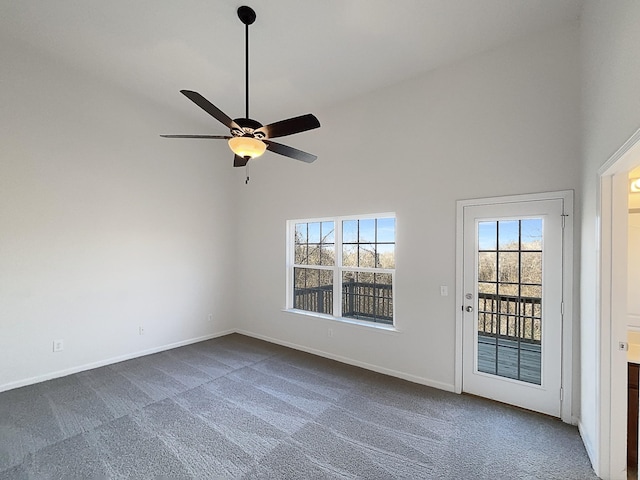 spare room with carpet floors, high vaulted ceiling, and ceiling fan