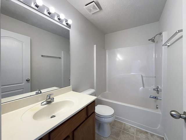 full bathroom with vanity, toilet, tub / shower combination, and a textured ceiling