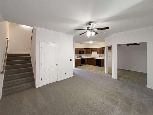 unfurnished living room with crown molding, ceiling fan, sink, and carpet