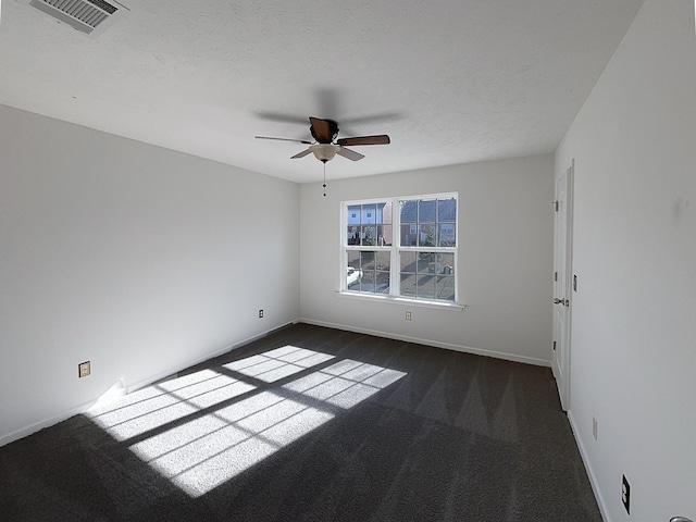 spare room featuring a textured ceiling and ceiling fan