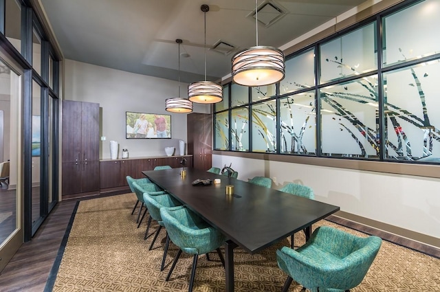 dining space featuring dark hardwood / wood-style flooring