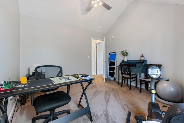 carpeted office featuring lofted ceiling and ceiling fan