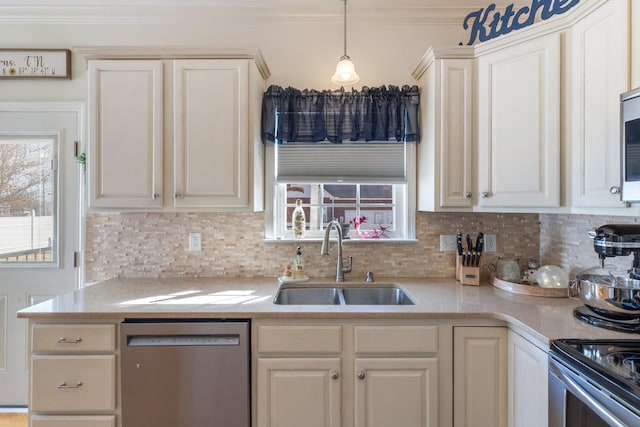 kitchen with appliances with stainless steel finishes, pendant lighting, tasteful backsplash, sink, and crown molding