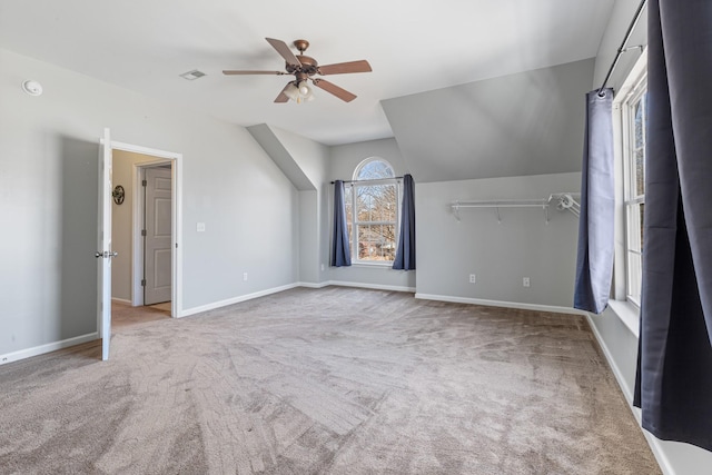 additional living space featuring ceiling fan, carpet flooring, and vaulted ceiling