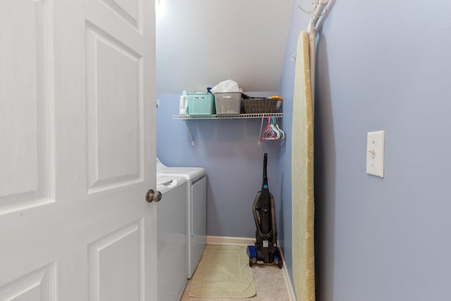 clothes washing area with washer and clothes dryer