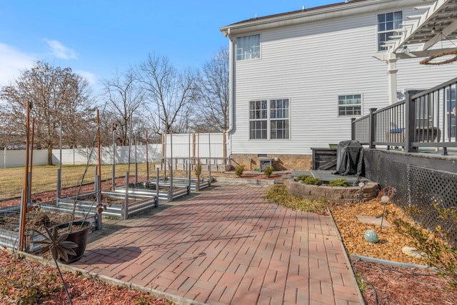 deck with a grill and a patio