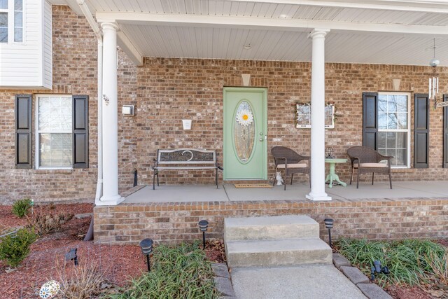 doorway to property with a porch