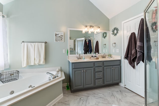 bathroom with independent shower and bath, vanity, and lofted ceiling