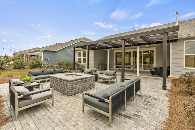 view of patio / terrace with an outdoor living space with a fire pit