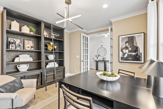 interior space featuring crown molding and an inviting chandelier