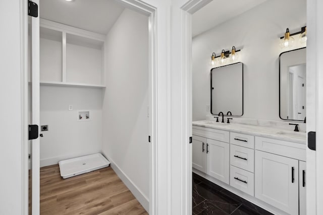 bathroom with vanity and wood-type flooring