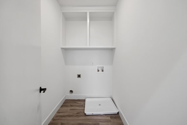 washroom with dark wood-type flooring, hookup for an electric dryer, and hookup for a washing machine