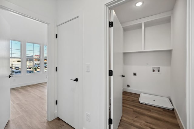 washroom featuring electric dryer hookup, washer hookup, hookup for a gas dryer, and hardwood / wood-style flooring