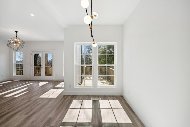 unfurnished dining area with french doors and wood-type flooring