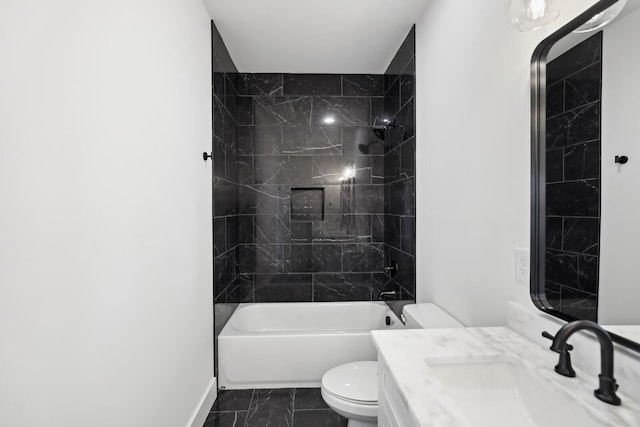 full bathroom featuring vanity, toilet, and tiled shower / bath combo