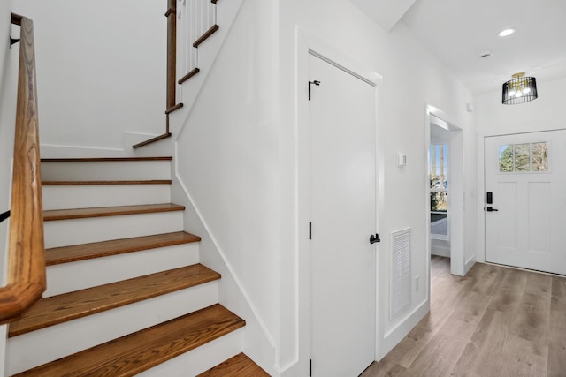 stairway featuring hardwood / wood-style floors