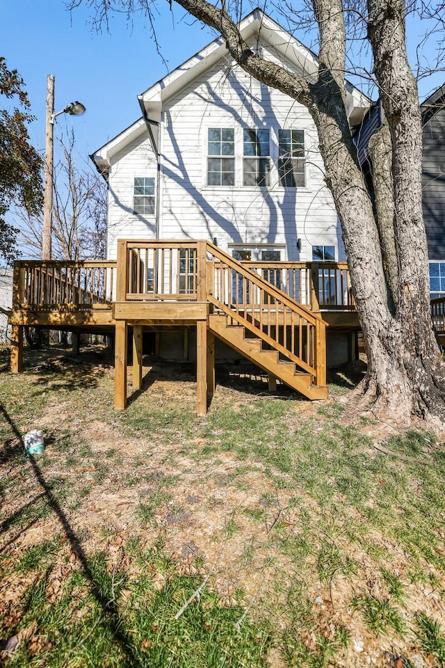 back of house featuring a deck