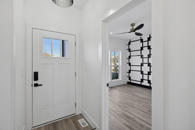 foyer entrance featuring ceiling fan and light hardwood / wood-style flooring